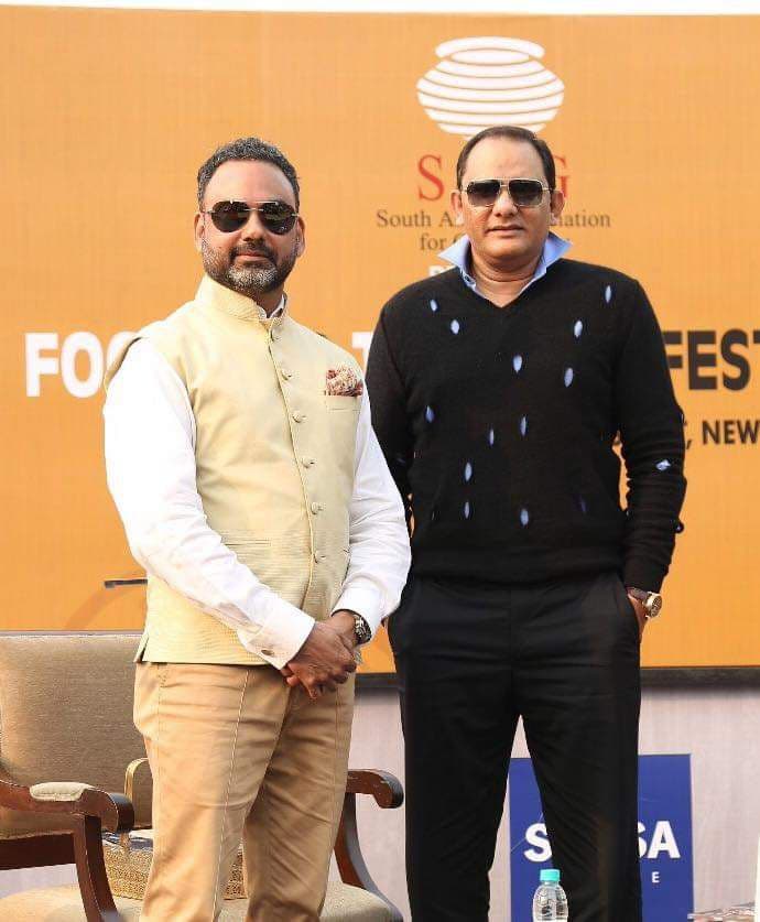 Group photo of distinguished gentlemen including Haute Services founder Maneesh Baheti with celebrities at an upscale evening event