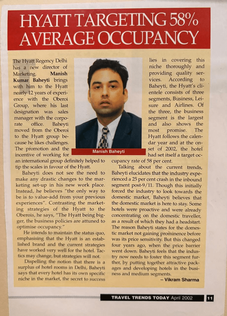 Travel Trends Today magazine article from April 2002 featuring Haute Services founder Maneesh Baheti discussing marketing strategies and occupancy targets for Hyatt Regency Delhi